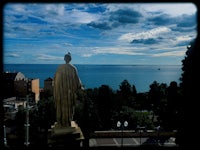a statue overlooking the ocean
