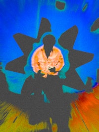 a man is sitting on the floor